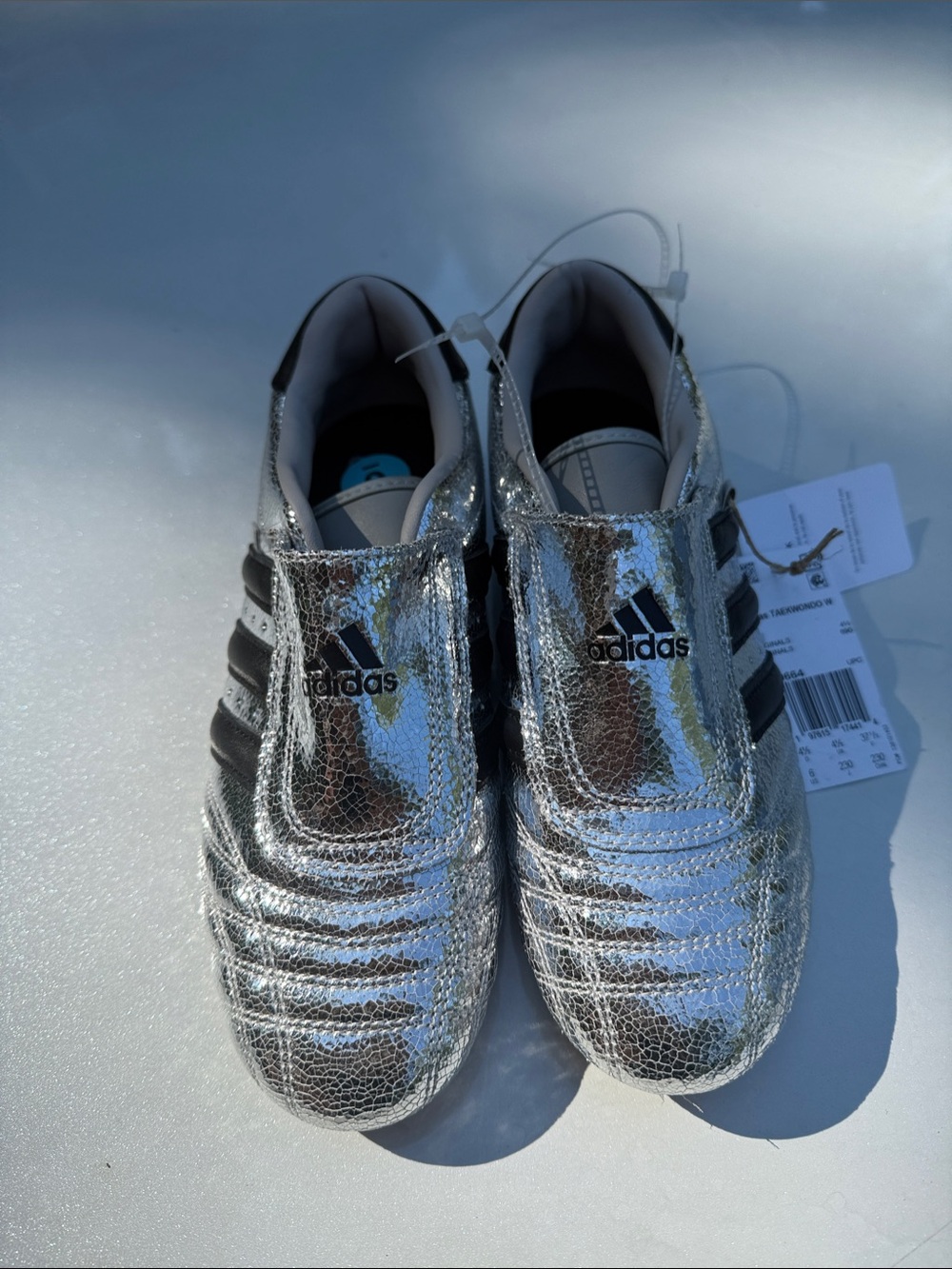 Adidas Metallic Silver Athletic Sneakers with Black Stripes